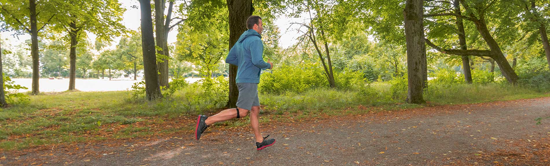 A man jogging in the woods
