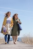 Two women are walking and wearing juzo expert stockings.