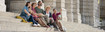 Family sitting on the staircases